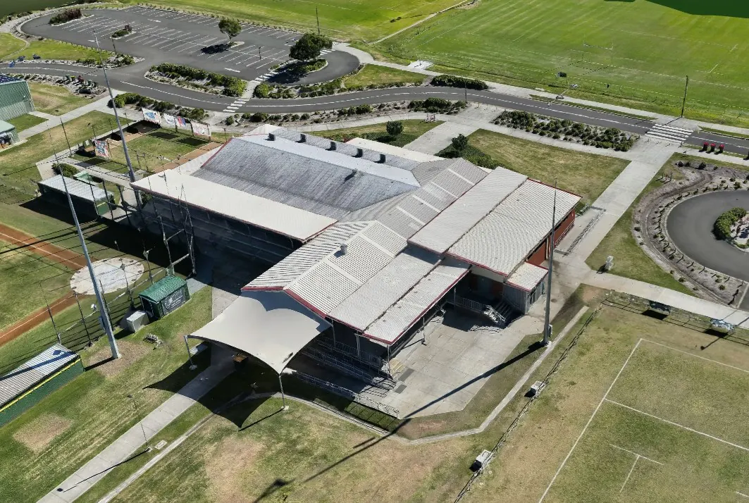 Textured 3D model of the clubrooms and surrounding fields, viewed from an angle.